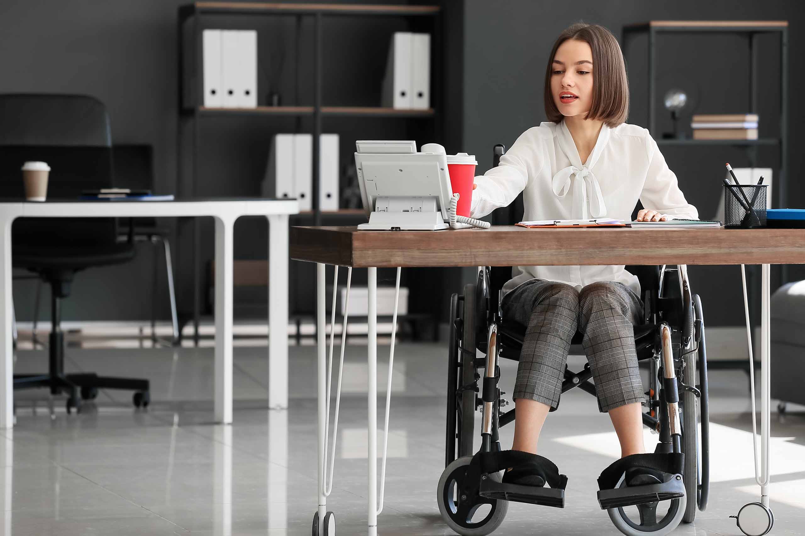 Woman working at a desk in an office.